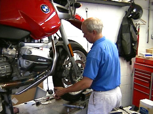 David Dorrance, the owner of Linder Cycle Shop, services Dan's R1100GS motorcycle.